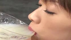Asian girl drinks cum from glass